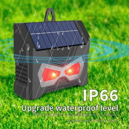 Outdoor Ultrasonic Solar Mouse Repeller With LED Flash mounted on grass with solar panel, LED strobe and IP66 waterproof rating