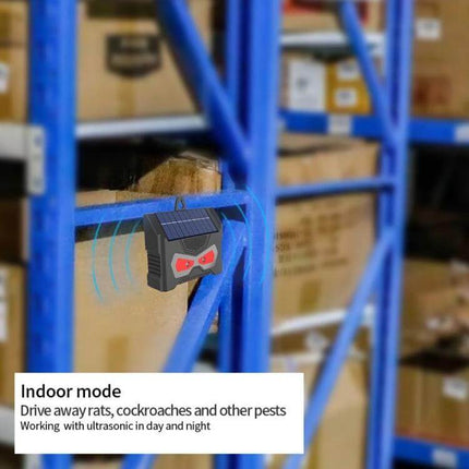 Outdoor Ultrasonic Solar Mouse Repeller With LED Flash mounted on shelving in a storage area with ultrasonic waves visible