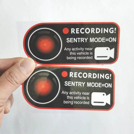 Sentry Mode Warning Sticker for Tesla Model 3, Y, S, and X - black/red recording sticker showing camera lens and "SENTRY MODE=ON" deterrent label
