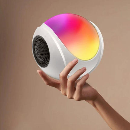 Portable Bluetooth Speaker Compact For Home And Travel Use white orb speaker with multicolor ambient light held in hand