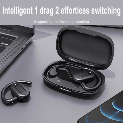 Open Fit Bluetooth Earphones With Case For Commuting shown in open charging case with one earbud beside laptop and phone