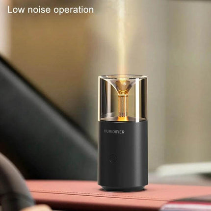Candle Flame Aromatherapy Diffuser, Mini Humidifier on a desk emitting fine mist with candle-like light and low noise operation