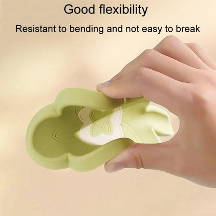 Practical Silicone Soap Dispenser for Everyday Bathroom Routines - flexible green silicone holder being bent to show durability