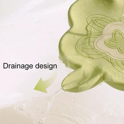 Practical Silicone Soap Dispenser for Everyday Bathroom Routines showing green silicone soap holder with drainage spout preventing soggy soap