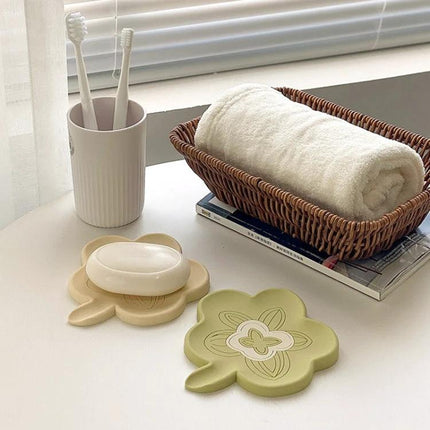 Practical Silicone Soap Dispenser for Everyday Bathroom Routines on a clean countertop with soap dish, toothbrush cup, and towel