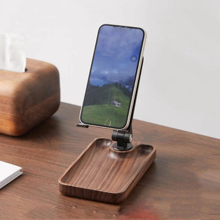 Adjustable Wooden Stand for Phones and Tablets at Home holding a smartphone on a walnut tray base for hands-free kitchen or bedside use