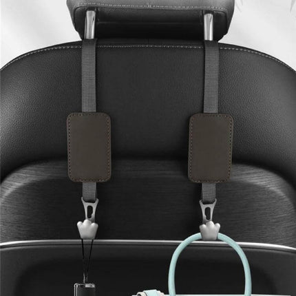 Leather Car Seat Hook Hanger For Vehicles To Organize Bags hanging on seatback showing leather pads, polyester lanyards and zinc alloy hooks holding bags and accessories