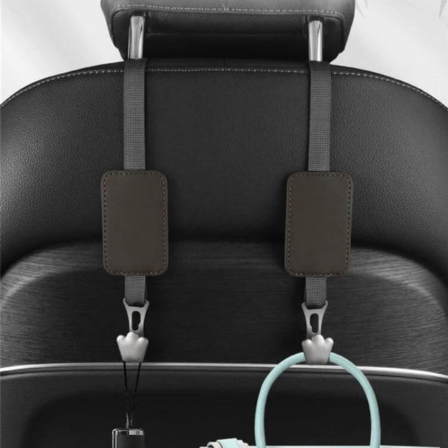 Leather Car Seat Hook Hanger For Vehicles To Organize Bags hanging on seatback showing leather pads, polyester lanyards and zinc alloy hooks holding bags and accessories
