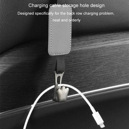 Leather Car Seat Hook Hanger For Vehicles To Organize Bags hanging on seatback with charging cable threaded through storage hole