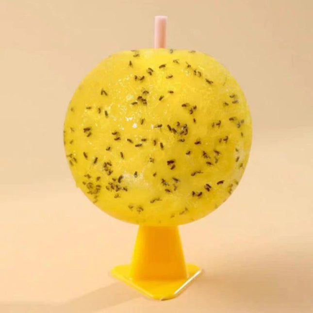8cm Indoor Fruit Fly Ball With Core Attractant For Home Use on yellow stand showing adhesive surface covered in trapped fruit flies