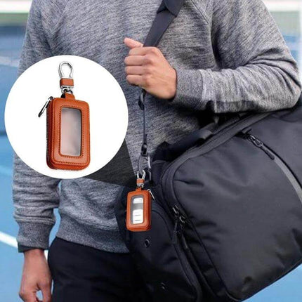Car Remote Control Universal Visible Zipper Key Case Royal Blue hanging from bag strap, cowhide exterior and swivel clip for easy access