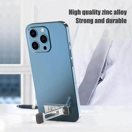 Light Gray Invisible Stand for Laptops and Tablets propped under a phone showing zinc alloy build and compact invisible design for travel and remote work