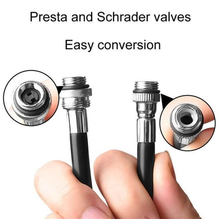 Mini Portable Bicycle Pump For Bikes On The Go Everyday showing Presta and Schrader valve conversion heads held between fingers