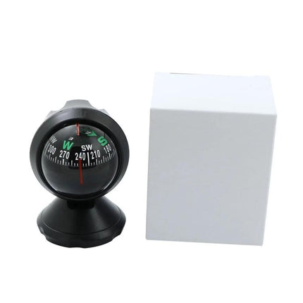 Compact Guide Ball Ornament for Everyday Car Interiors black magnetic compass on dashboard next to white box