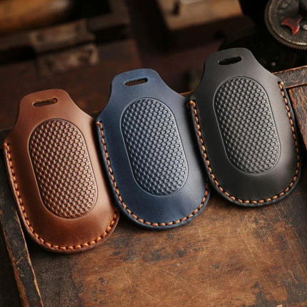 Sanyang Hallmo Motorcycle Key Case Cowhide Protective Cover in brown blue and black leather with hand-stitched edges and textured grip
