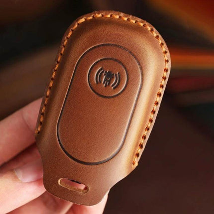 Sanyang Hallmo Motorcycle Key Case Cowhide Protective Cover in brown cowhide, hand-stitched protective key shell with precise holes and snug fit