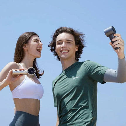 JisuLife Portable Rechargeable Handheld Cooling Fan for Everyday Use shown in use by smiling couple outdoors for commuting and activities