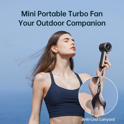 JisuLife Portable Rechargeable Handheld Cooling Fan for Everyday Use held by woman outdoors with anti-lost lanyard and steady breeze
