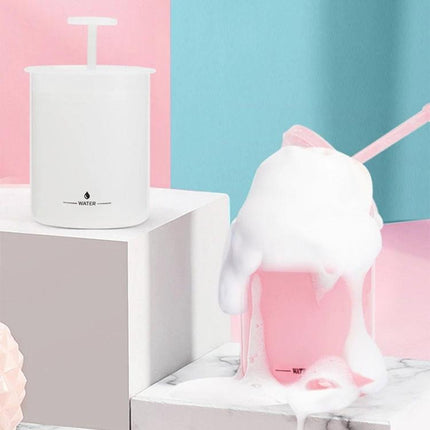 Portable Foaming Cup for Daily Skincare and Travel Use shown in white and pink creating rich facial cleanser foam