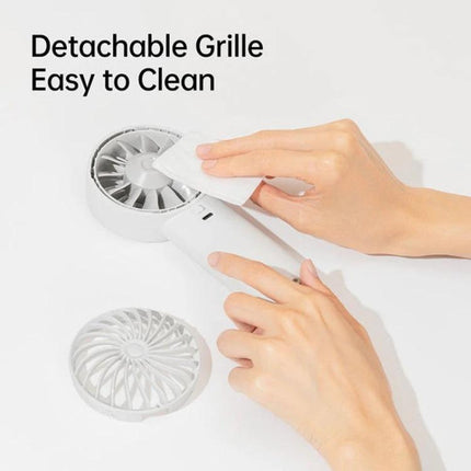 JisuLife Life4 Rechargeable Handheld Fan for Daily Cooling shown with detachable grille being wiped clean, demonstrating easy cleaning and compact design
