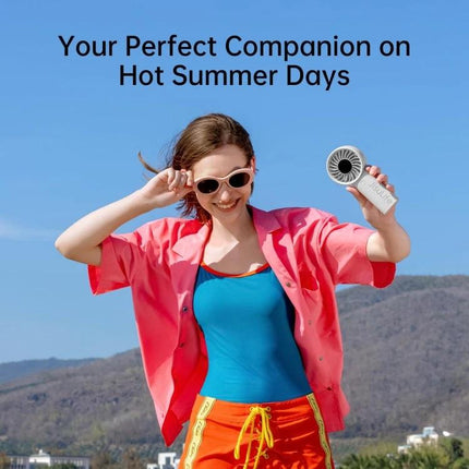 JisuLife Life4 Rechargeable Handheld Fan for Daily Cooling held by smiling woman outdoors, compact portable fan for commuting and summer days