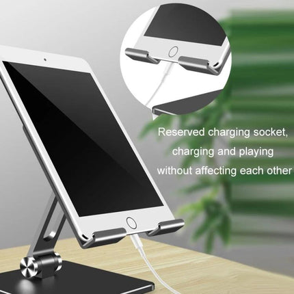 Desktop Adjustable Folding Stand for Tablets and Phones on desk with charging cable and adjustable angle