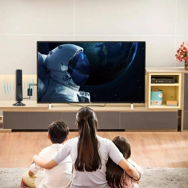 Indoor Digital TV Antenna for Local Channels with Amplifier mounted near TV in family living room improving reception