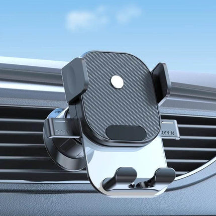 Car Phone Holder With Automatic Lock Dashboard Mount attached to car vent showing gravity-sensing clamp, silicone pads and bottom charging port