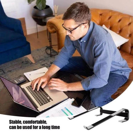 Aluminum Alloy Laptop Stand for 10-18 Inch Desktops on a home office table elevating a laptop for ergonomic posture