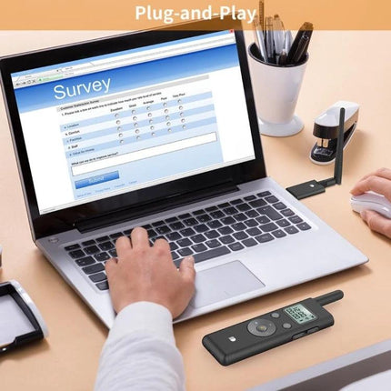 Doosl Long Distance Laser Page Turner for Presentations on desk beside laptop showing presenter controlling slides and timer