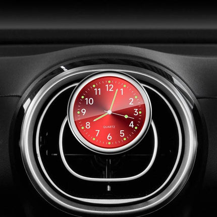 An Essential Luminous Clock for Everyday Car Drives mounted on a car vent with glowing red luminous dial for night visibility