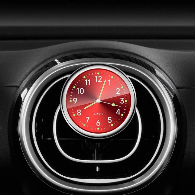 An Essential Luminous Clock for Everyday Car Drives mounted on a car vent with glowing red luminous dial for night visibility