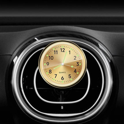 An Essential Luminous Clock for Everyday Car Drives mounted on car air vent with glowing dial for easy night time viewing