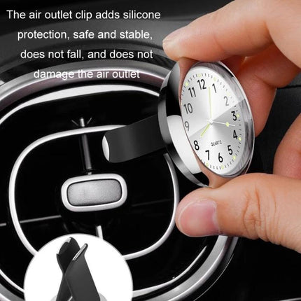 An Essential Luminous Clock for Everyday Car Drives mounted on an air vent with silicone clip showing luminous dial for easy night glances