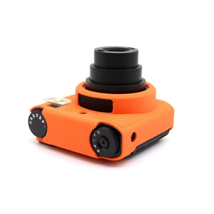 FUJIFILM Instax Mini 99 Silicone Protective Camera Case in bright orange fitted on Instax Mini camera showing lens, controls and textured grip