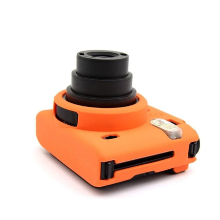 FUJIFILM Instax Mini 99 Silicone Protective Camera Case in bright orange fitted on instant camera showing lens and flash access