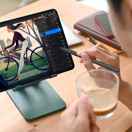 Microsoft Surface Compatible Anti-Touch Handwriting Pen being used to draw on a tablet with palm rejection while a user holds a coffee cup