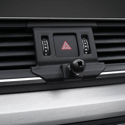 Audi Dashboard Phone Holder Mount For Left Hand Drive Cars clipped to dashboard vent near hazard button for hands-free navigation