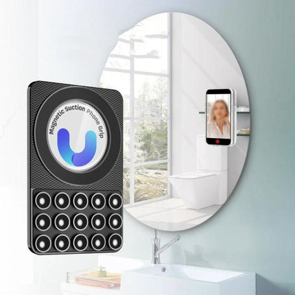 Magnetic Silicone Phone Stand for Hands-Free Surface Mounting attached to bathroom mirror holding smartphone for hands-free selfies and viewing