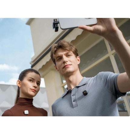 Connect DJI Mic Mini Adapter to iPhones for Daily Audio Tasks — two people using Mic Mini receiver clipped to shirts while recording with an iPhone