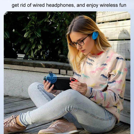 2-In-1 Car Bluetooth Audio Receiver And Transmitter shown clipped to a phone while a woman wears Bluetooth headphones outdoors