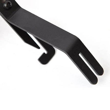 American Standard License Plate Frame for Tesla Models 3 and Y black metal mounting bracket close-up showing pronged end and screw attachment