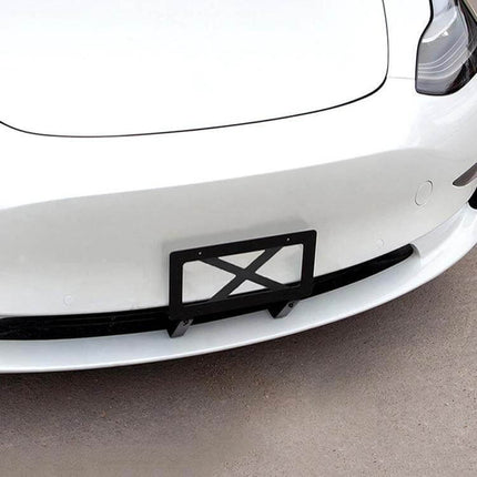 American Standard License Plate Frame for Tesla Models 3 and Y mounted on white Tesla front bumper, black metal plate frame