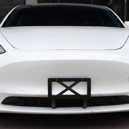 American Standard License Plate Frame for Tesla Models 3 and Y mounted on white Tesla Model 3 front bumper, sturdy metal plate frame for secure installation