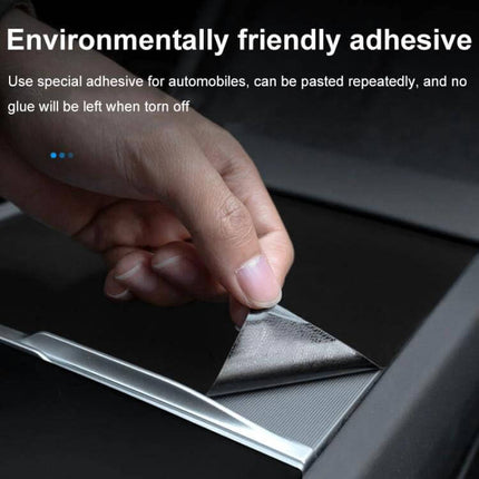Tesla Model 3 Center Console Protection Sticker Carbon Fiber Grain applied with repositionable adhesive protecting armrest surface