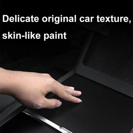 Tesla Model 3 Center Console Protection Sticker Carbon Fiber Grain showing hand touching textured console protection film mimicking original car texture