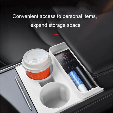 Integrated Silicone Storage Cup Holder for Tesla Center Console showing white silicone insert with cup and small items neatly organized under armrest