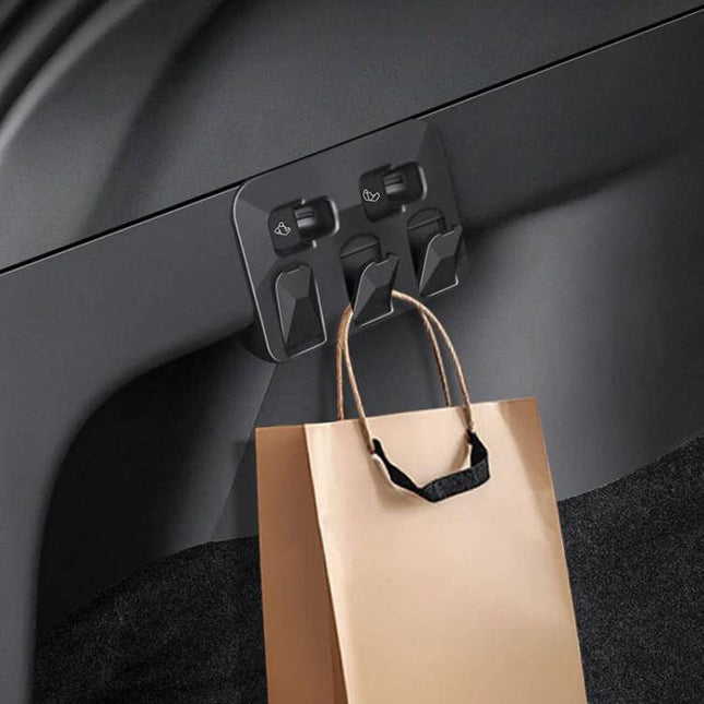 Hidden Trunk Hook for Tesla Model Y Foldable Car Organizer installed in trunk holding a shopping bag, snap-in foldable ABS hook