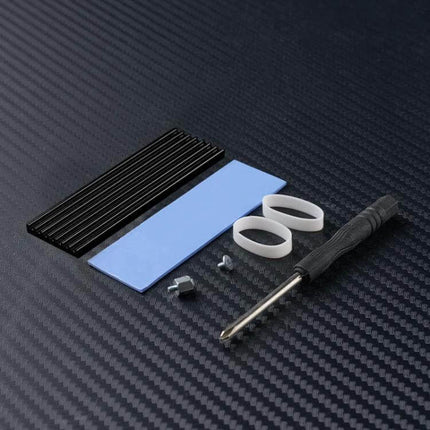 FinalCool Aluminum Heat Sink for M.2 2280 SSDs in Gold showing heatsink, thermal pad, mounting screws and screwdriver for SSD cooling