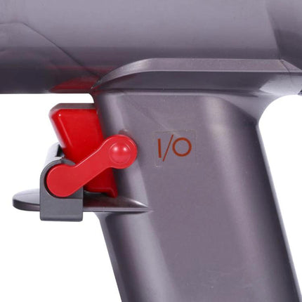 Dyson Vacuum Switch Latch Retainer for Hands-Free Cleaning red latch attached to Dyson power button showing I/O marking
